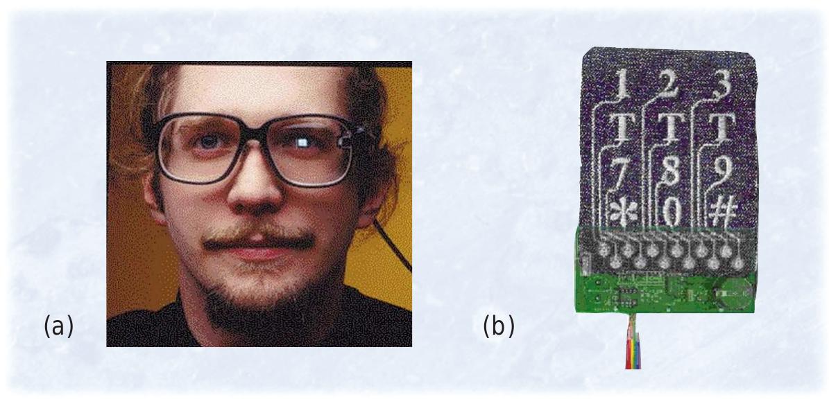 Figure 1. Unobtrusive interfaces: (a) MicroOptical’s head-mounted display and (b) a  cloth keyboard from MIT Media Lab that can be woven into its user’s clothing. These  devices represent the first steps toward making wearable computers more pervasive. (Image of MicroOptical’s head-mounted display courtesy of Sam Ogden) 