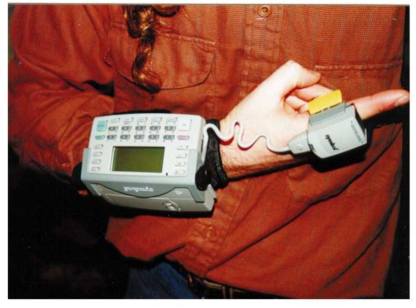 Figure 2. Symbol Technologies’ wearable bar-code scanner and computer. The product is being used by United Parcel Service and has been sold to various retail chains. To date, user acceptance is high. 