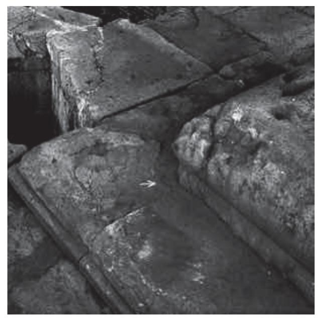 Fig. 9. Northeast corner of eastern altar, looking southeast  (ASRCM, 1970, MSA 230).  Fig. 10. Incised setting line at southeast corner of northern block of eastern altar (Author). 