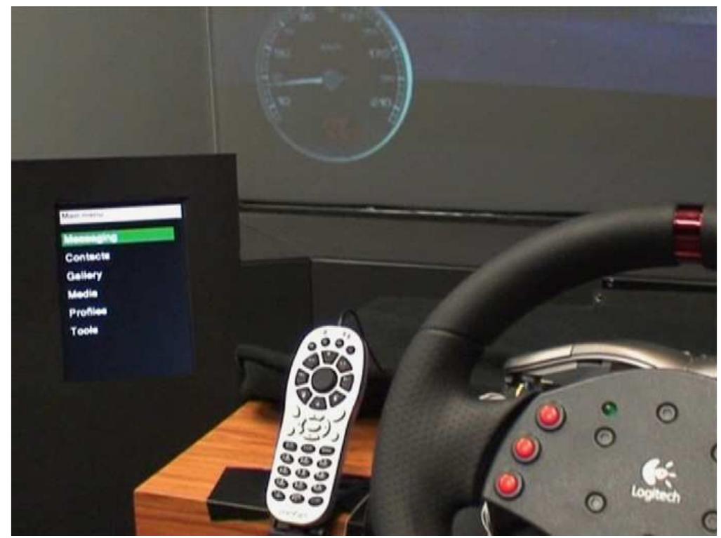 Fig. 1. The visual interaction based on a small screen and phone-like keyboard. The items in the visual menu were displayed in large white fonts and the selected item was highlighted with a green bar. 