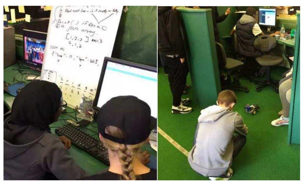 Fig. 2. Teams working on their prototypes in the Bridge21 learning space Left: Team sketches out pseudo code for their heartrate monitor. Right: A tear tests their robot on the floor, and a team pod can be seen in the background 