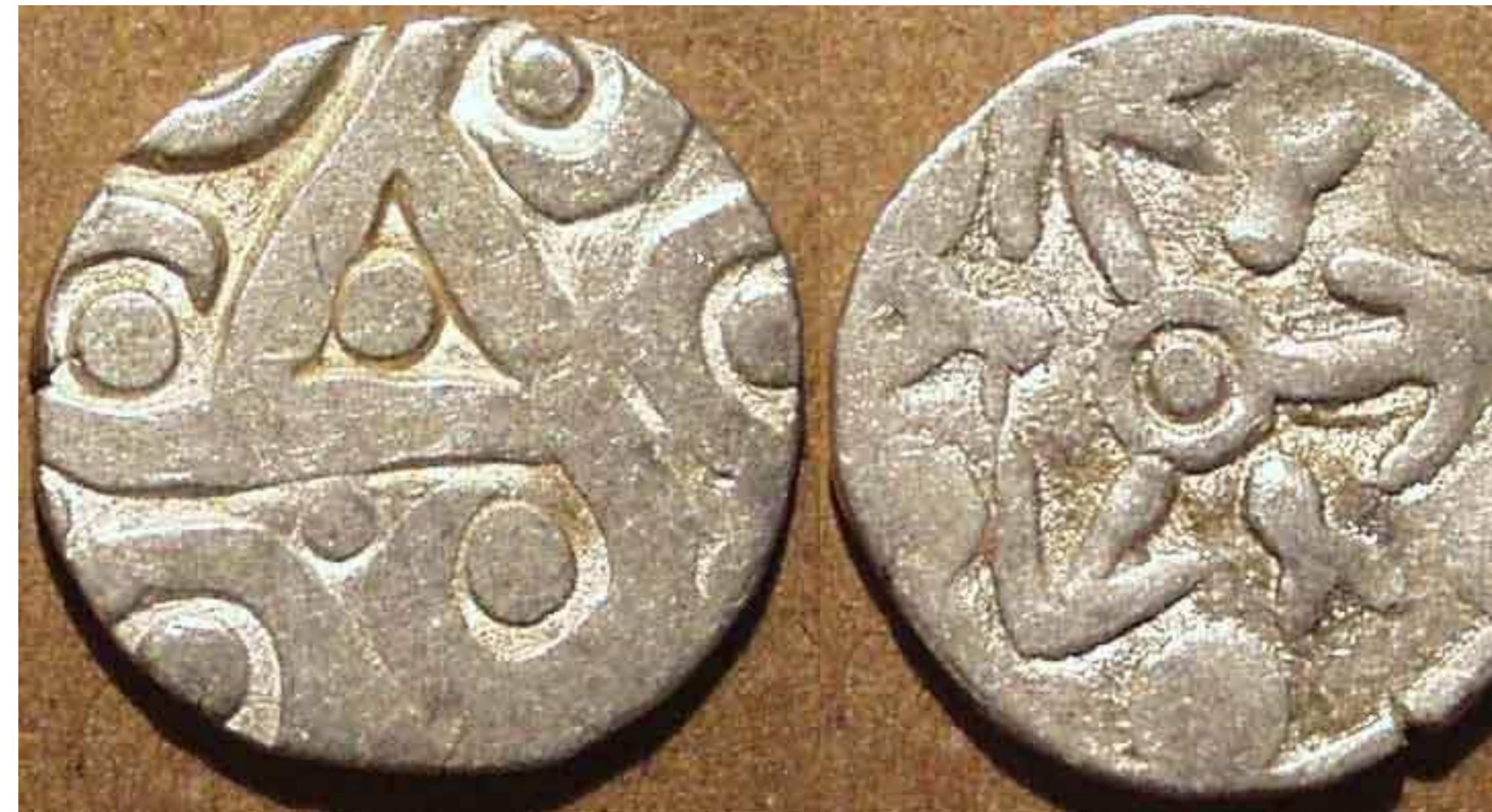Silver 1/2 karshapana c. 400-350 BCE Weight:1.53 gm., Diam: 15 mm. Triskele with crescents and dots /  Magadhan ?) 6-arm symbol Ref: Rajgor, 428.  Rajgor has suggested that this coin is an overstrike "on an earlier type having a Six-armed-like symbol." However, on this specimen, if there is any flattening, it is on the "obverse" side with the triskele design. This might suggest that the six-arm symbol was either added later or  simultaneous to the triskele. Perhaps this was issued shortly after Mahapadma Nanda annexed the Kuru lands to Maadadha.  