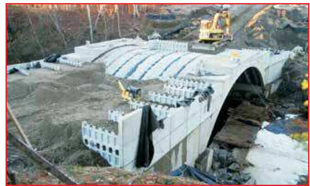 Attachment of headwalls, wing walls, and backfilling the