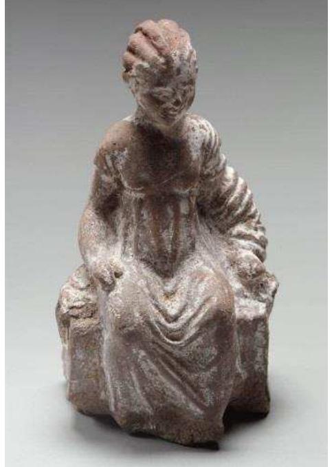 Figure 47. Terracotta figure of a girl seated on a bench, possibly a local copy of a Greek ‘Tanagra’ type figurine, 3rd century BC, from a house in the town area of Naukratis. Museum of Fine Arts, Boston, 86.398. Photograph © Museum of Fine Arts, Boston.  Figure 46. Terracotta figure plaque with a nude woman in relief, c. 550-400BC, from Naukratis. McLean Museum & Art Gallery, Greenock, 1987.375. Photograph © McLean  Museum and Art Gallery, Greenock.  probably at Naukratis itself, where the discovery of moulds and wasters confirm the existence of local workshops. The figurines fall into three mair categories. Imported Cypriot figurines are frequent in the earliest period o1 the site from the late 7th century BC onwards, but very rare after the 6th century BC. They were largely replaced in the late Archaic and early Classical period by Greek figurines, in particular the popular East Greek types, rare examples of which were already present at the site from the time of its foundation. Finally, locally made figurines (which equally date back to the beginning of the site) flourished particularly from the 5th century BC and became dominant from the early Hellenistic period onwards; they include some Greek style figures, but mostly represent loc Egyptian types. 