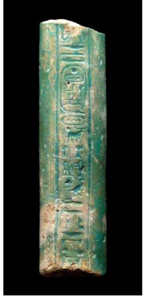 Figure 54. Faience sistrum handle fragment with hieroglyphic inscriptions mentioning Amun and Mut of Baded, reign of Ptolemy II (283-246 BC). Musée du Louvre, Paris, E6268. Photograph © Musée du Louvre/Georges Poncet.  Figure 53. Bronze votive box of a lizard, probably from the bronze cache in the town area of Naukratis, late 5th—-early 4th century BC. Bolton Museum, 1886.31.67.f. Photograph © Bolton Library and Museum Service.  Also represented are Horus, Anubis/Upuaut, Atum and Neith, whose cults are attested at Sais. While some figures lack a recorded findspot (and for some even the general findspot of Naukratis is not assured), many are known to come from a single location in the town, a cache of bronzes (and some other objects) discovered in a building in the southern part of the city for which associated finds now confirm a late 5th to early 4th century BC date (Petrie 1886a, 41—2; see also Masson forthcoming a). 