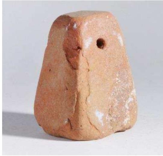 Figure 70. Greek-type loomweight, 6th—4th century BC. McLean Museum & Art Gallery, Greenock. Photograph © McLean Museum and Art Gallery, Greenock / Inverclyde Council.  Figure 71. Barbed iron fishing hook, probably 5th—4th century BC, from the town area of Naukratis. World Museum, Liverpool, 9,9,86,126.b. Photograph © National Museums Liverpool (World Museum).  Further tools and implements include Greek limestone sundials, bronze strigils (one example from the cemetery), (Roman) metal keys and a dozen bells (mostly made of bronze, but one also of silver) — several of typical Egyptian type — which may have had a ritual or amuletic function. A small yet highly diverse group of loomweights is particularly noteworthy as rare attestations of women’s work; they comprise both imported and locally made examples of Greek type (Fig. 70), to which the recent fieldwork now adds Egyptian-type loomweights as well as fragments of Archaic Greek pottery re-used as likely loomweights (Thomas and Villing forthcoming). 