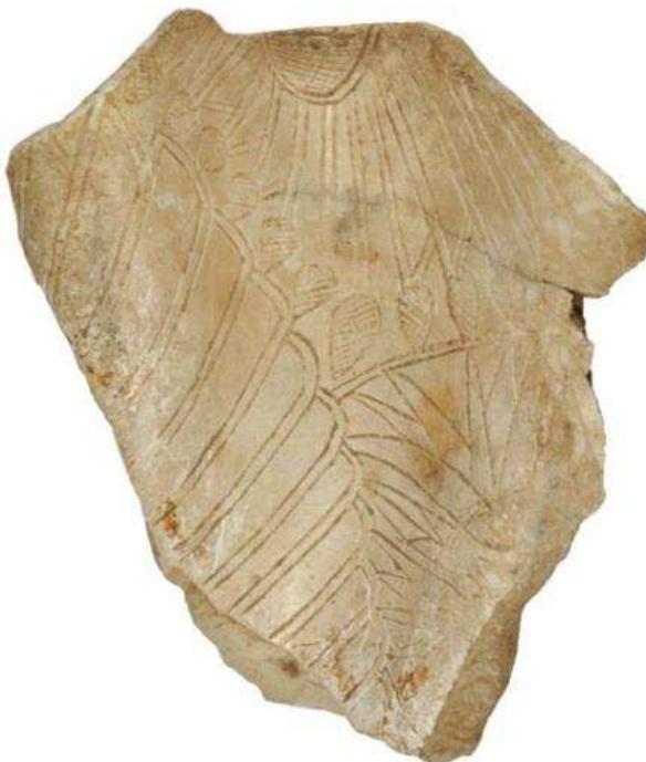 Figure 73 Tridacna shell fragment, engraved decorating featuring wings, lotus flowers and buds. 7th-6th century BC. Ashmolean Museum, Oxford, AN1896-1908-G.451. Photograph © Ashmolean Museum, University of Oxford. 
