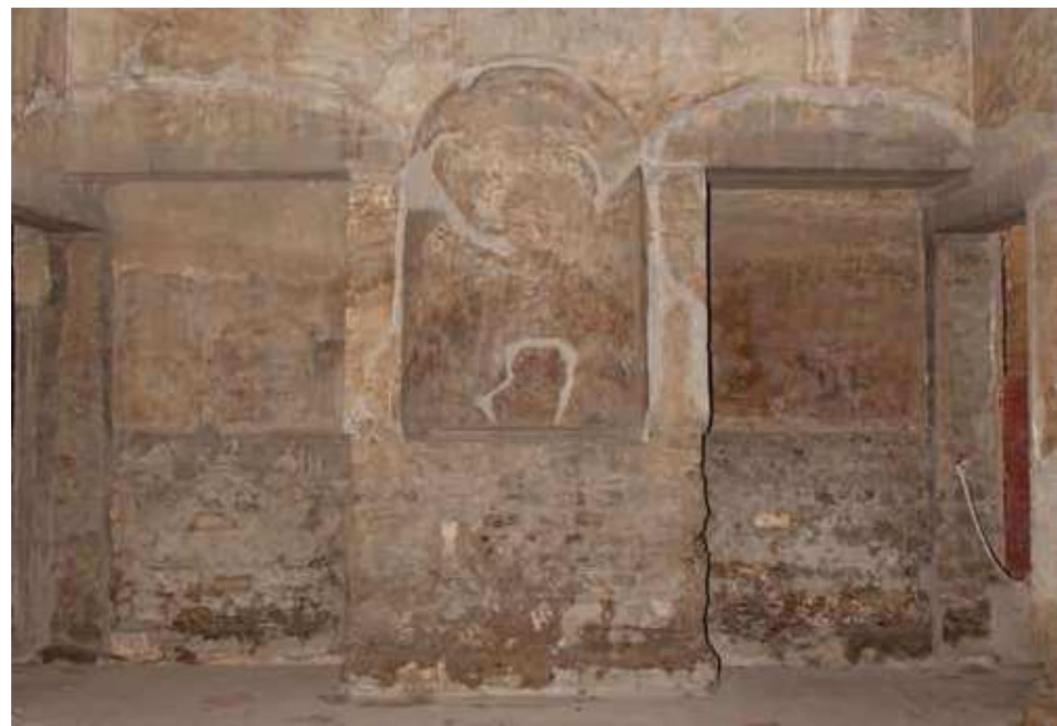 another as pendants.'? Others like the Satyr and Her- maphrodite served as focal points that punctuated axial views. Viewed from the north, this statue group, along with a large marble crater that served as a fountain, led the eye toward the sea (see fig. 13.3 and fig. 13.2, nos. 12 and 13.) Viewed from diaeta 78, the crater fountain ap- peared at the center of the large window that frames the view to the east.  the east wing, however, were supplied with niches (65 and 74) that most likely did hold statues or urns (fig. 13-13) or, perhaps as De Caro suggested, the statuette of Aphrodite (see fig. 13.9). Bedroom-sitting rooms like cubiculum 11 and day rooms like diaeta 78 might also be sites of sculptural display, especially for small pieces that rewarded close observation. In Villa A, cubiculum 11 looks onto an interior garden courtyard (19) that might well have contained small statues (see plan). Another interior garden in the western part of Villa A (16) preserves a central pedestal with a pipe that probably supplied water  to an urn or statue (see fig. 12.4) The small garden rooms in the east wing, however, apparently did not have such ornaments at their centers, though their wall paintings vividly depict them (see figs. 9.17-9.18).  XK71 #11 1 +. ~ T +1 