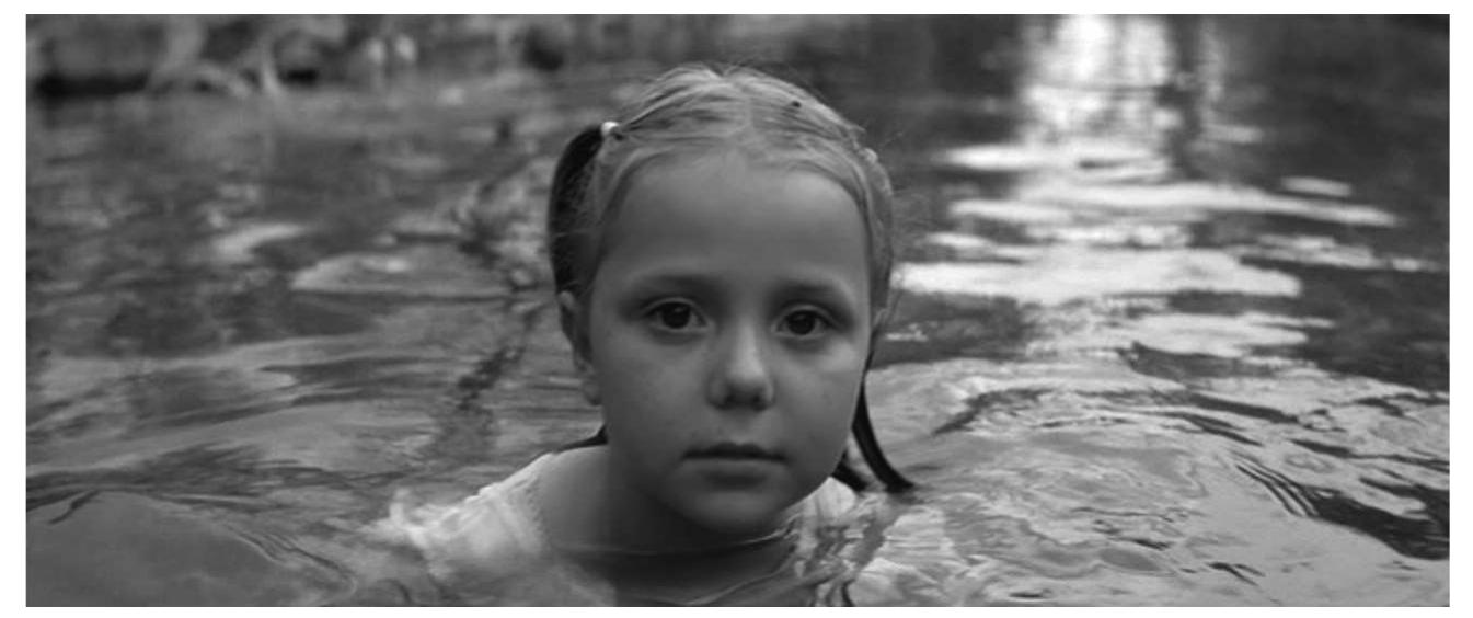 Breaking the fourth wall: a child looks into the camera in Silent Light 