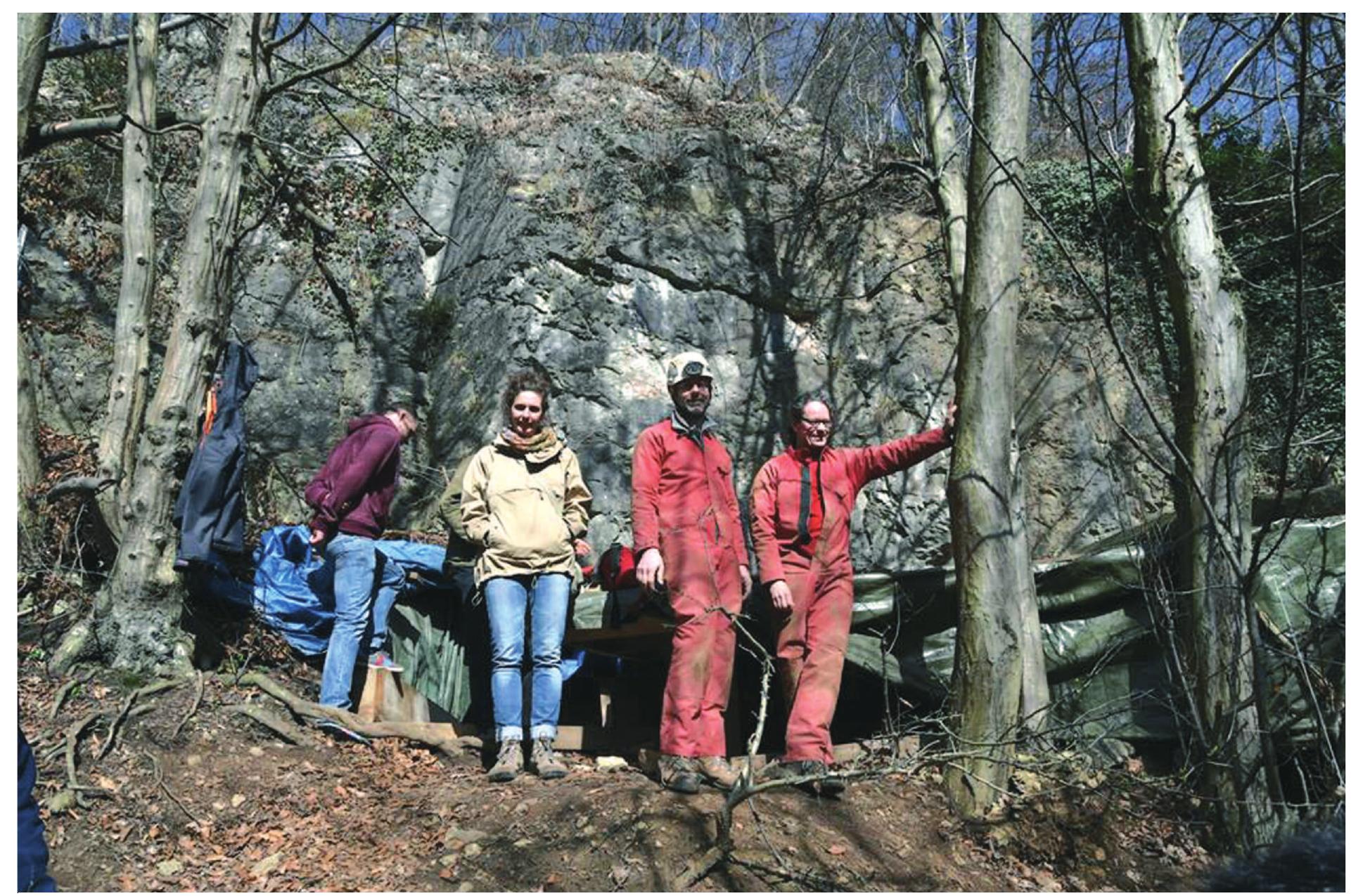 Fig. 3 In front of the Blatterhdhle in Hagen with Jorg Orschiedt (right) and Wolfgang Heuschen (left) who both gave the guided tour of the cave site. Special “cave suits” and a helmet are required to enter the cave (Photograph: A. Baus). 