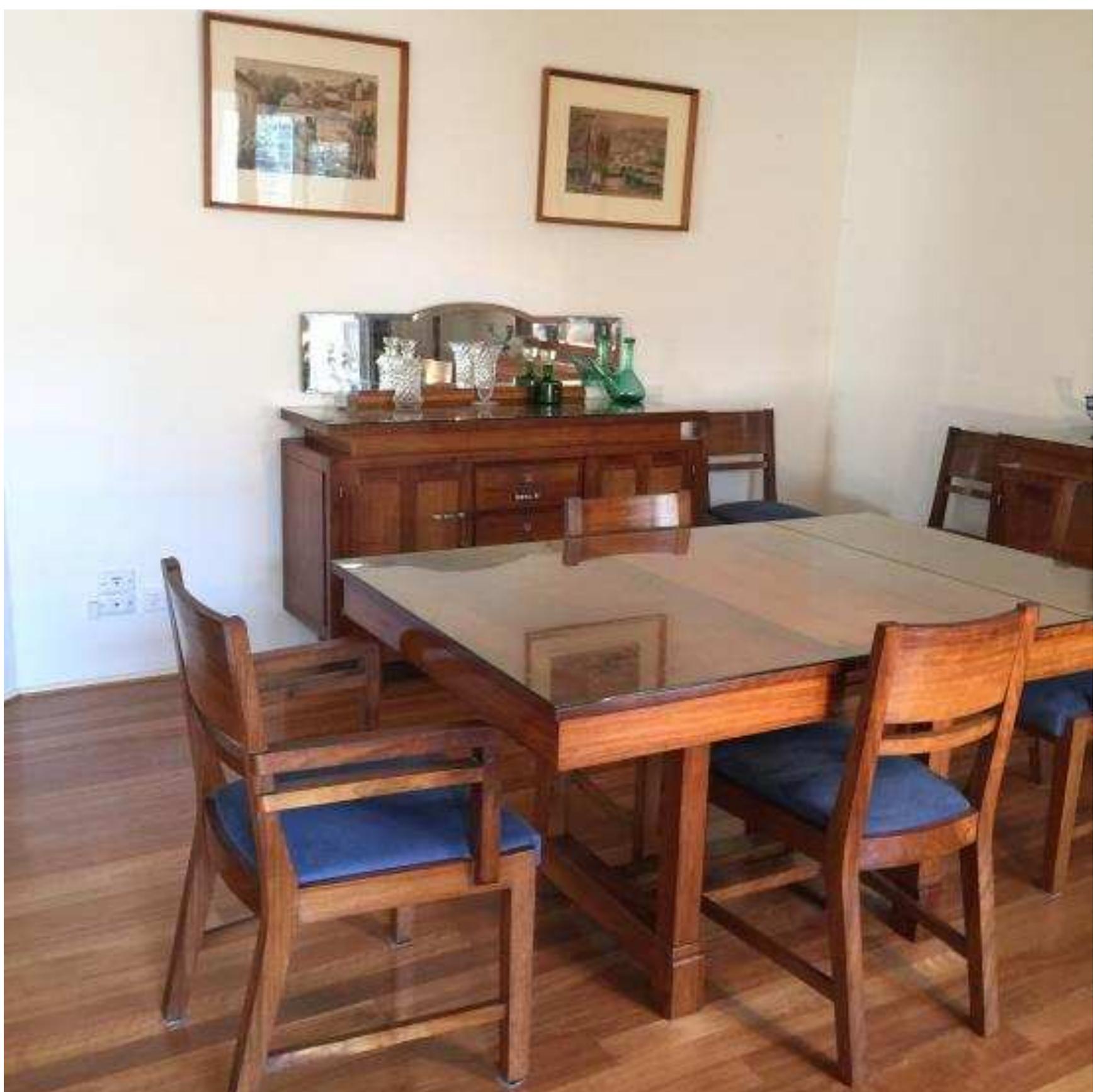 Figure 1. The furniture made from African wood, now in my mother’s dining room in Australia.  The paintings are of Coimbra and the surrounding countryside.  washhouse in our back garden. We children knew to stay out of the way on those 
