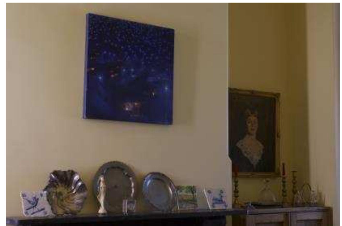 Figure seven. A new home. This collection of objects symbolizes the traces of my life in Portugal and here in Australia. All the objects have a personal significance. The tile with the rabbit was bought by myself in Lisbon in 2010. I wanted it to keep company with my father’s tile but this time bought by myself! The sculpture of the Virgin Mary used to belong to my father as did the small clock. The silver and pewter plates — one is Portuguese, given to my parents as a wedding present, and the others belonged to my husband’s family. The painting was done by a friend of mine in Perth where we lived for ten years. Above the cupboard is a painting of my mother-in-law, done when she was 21 years old  as well as objects from Portugal. Together, these objects cover my life in Portugal, my husband’s  favatl<er and nin fatanatharn  Figure seven. A new home. This collection of objects symbolizes the traces of my life in Portugal and  here in Australia. All the objects have a personal significance. The tile with the rabbit was bought by 