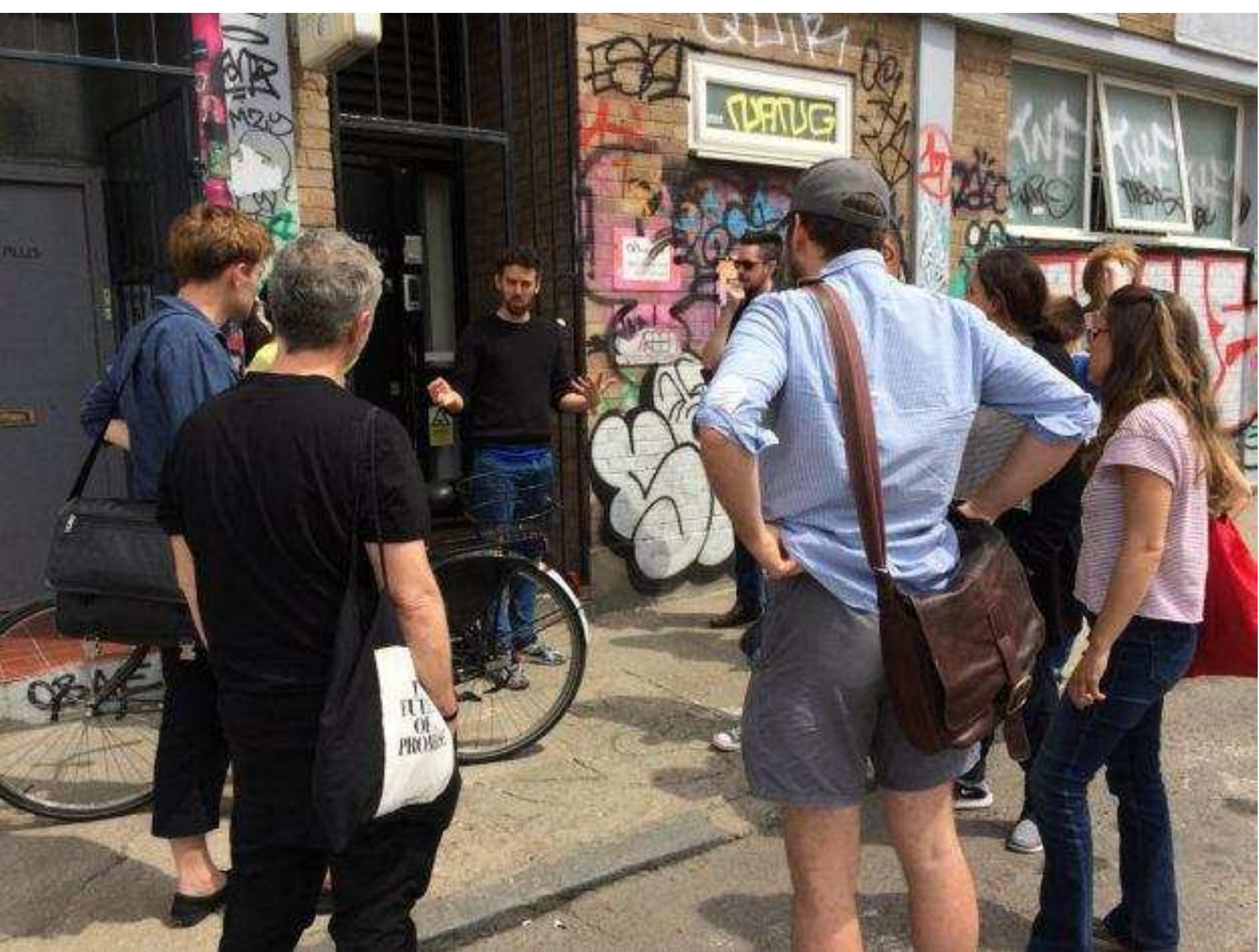 The Crowd Control team on walking tour of Hackney Wick. Photo © Kira Wainstein  The points of reference shifted across scale and between species: from the collective communicatio of single-celled organisms, to group dynamics of social animals, and to human demographics and changing populations. Nonhuman elements were also brought into play, through the material and symbolic structures that affect our behaviour, such as legal frameworks, cultural norms and social expectations. Connections were constantly made between contexts and systems, and between disciplinary modes of thinking and methods of inquiry. The aim of this approach was to investigate the underlying mechanisms of collective behaviour from multiple perspectives simultaneously, to engage in open-ended exploration of shared research questions, and to engage the public in the process of experimentation. The project was fully participatory, not only in terms of the varied composition of the creative team, but significantly in terms of the volunteers who signed up to test and play the games as they developed, and who essentially provided the ‘crowd’ that willingly offered itself to be ‘controlled’.  changing populations. Nonhuman elements were also brought into play, through the material and 
