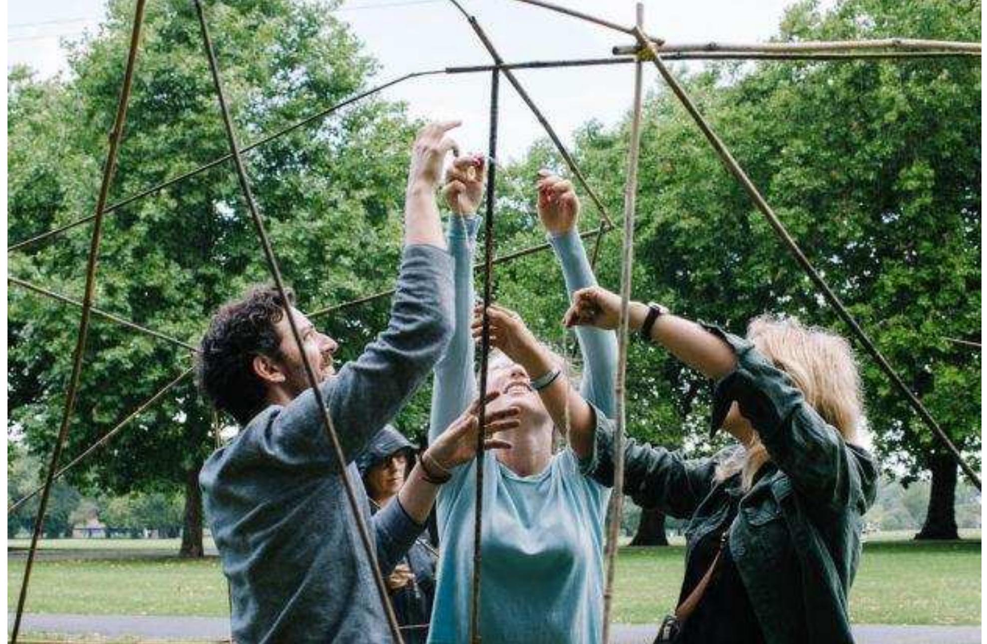 Collaborative building strategies in Nesting Groups. Photo © Luka Radek  In the game there were three colonies, each containing six individuals. At first no specific rules were given, only the physical boundaries of the nest foundations. Teams were able to communicate to define structural efficiency and nest design. After 30 minutes of building, the rules changed and each individual was given a specific task: build towards the other colonies; build upwards to avoid a flood; or build to increase surface area of the nest. However, they were unable to communicate with the  rest of their colony.  The expectation was to observe hierarchal organisation in the first part, with leading individuals designing the overall form; but with more chaotic building execution in the second part based on the simplicity of the rules given and lack of communication within the colony. Regarding structure, the three groups built in very different ways: Group A used systems based construction, to form a 