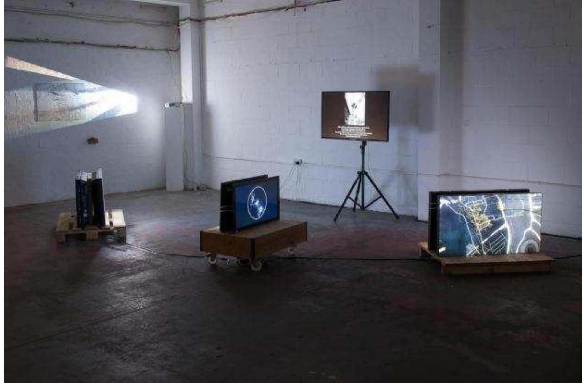 Installation view of Testing Station exhibition at Arebyte Gallery, Wallis Road 21-23 July 2017  The events and experiments were complemented by a pop-up exhibition at Arebyte Gallery, displaying observations, simulations, visualisations and live experiments exploring the mechanics and aesthetics of collective motion. Some of the behaviours that were explored through the participatory experiments and games were also represented within the gallery installation through projections, screen based works, objects and interactive media. For example, works revealed the collective behaviour of ant colonies and slime moulds cells, the behavioural algorithms of self- propelled particle models, and agent based modelling of urban systems. 
