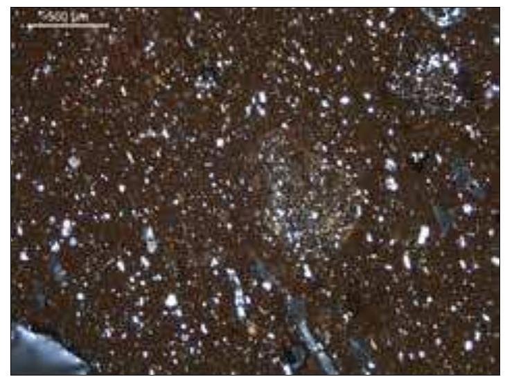 Figure 4. Photomicrograph illustrating fine, micaceous fabric from Kontopigado-Alimos, sample T102 XP  Figure 2. Photomicrograph — illustrating volcanic fabric thought to be from Kos, sample T100 XP 