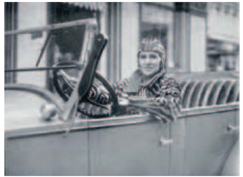 Stone’s 1929 photograph of a woman in a zebra-striped outtit displays her as happy and decidedly modern as she sits in the driver’s seat of her convertible. This link between dynamism and delight — between motion and emotion — has been explored by film historian Giuliana Bruno. She asserts an intimate connection between the terms of move- ment and vision, between the voyeur and the voyageur, and she explores forms of mapping which might convey an interior, emotional landscape.° This linkage of vision and experience is essential for exploring the processional nature of Pariser Impressionen. Many of its photographic fragments suggest three-dimensional depth and layered locations in space, where, for example, the large pink legs appear closer to us than does the double-decker bus. Brandt has also left part of the white frame visible around the Eiffel tower, providing a pictorial window which allows us to look deep into the photograph. This image of three- dimensional space serves as another mode of representing embodied movement through Paris.  s- =  While the montage elements of Pariser Impressionen seem to cascade from the top of the composition down- wards, we can also interpret them as emanating from the lower right corner where these images of mobile women are located, and moving ever upwards in a crescendo of delight in the city. A decade after she created this montage, Brandt would write to old friends living in Paris of how much she missed that city; “i am just not good at making money! and when you don’t have anything, the most beau- tiful city in the world isn’t worth much.“¢ Already by 1926, the second time that she was living there, it seems that Brandt's imagination had been captured by the possibilities of visuality, mobility and pleasure that Paris offered.’ 