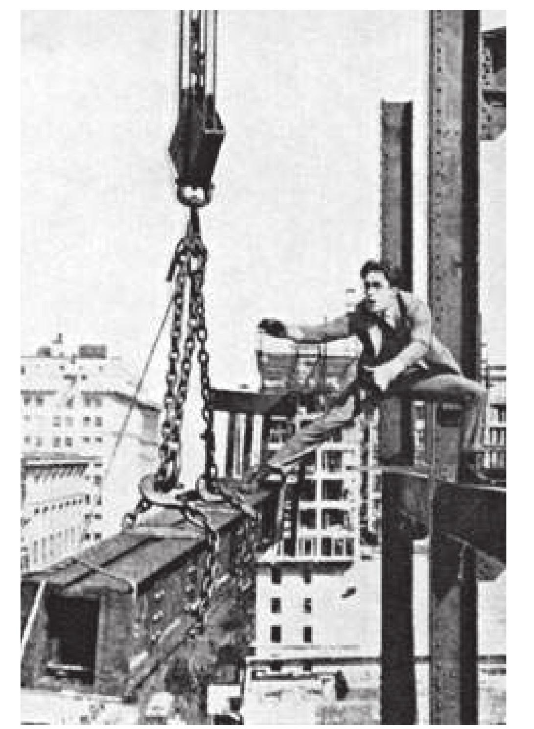 Behind these three images of Lloyd performing his predictable smile is a photograph of a majestically deep space, probably a dry dock for building giant war or  Hinter den drei Bildern des standig lachelnden Lloyd tut 