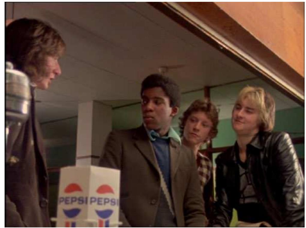 Figure 1. Tony and ‘the lads’. British working-class youth culture in Pressure (1976).  graduated with fewer qualifications than Tony, is in work and thus able to afford the leisure activities and clothes that Tony cannot. When Dave invites Tony to ditch the youth club for the disco, Tony is hesitant as he has no money, so Dave and his friends offer to pay Tony’s way. The sort of financial pressure experienced by Tony here is described by Willis (1977) in Learning to Labour: 