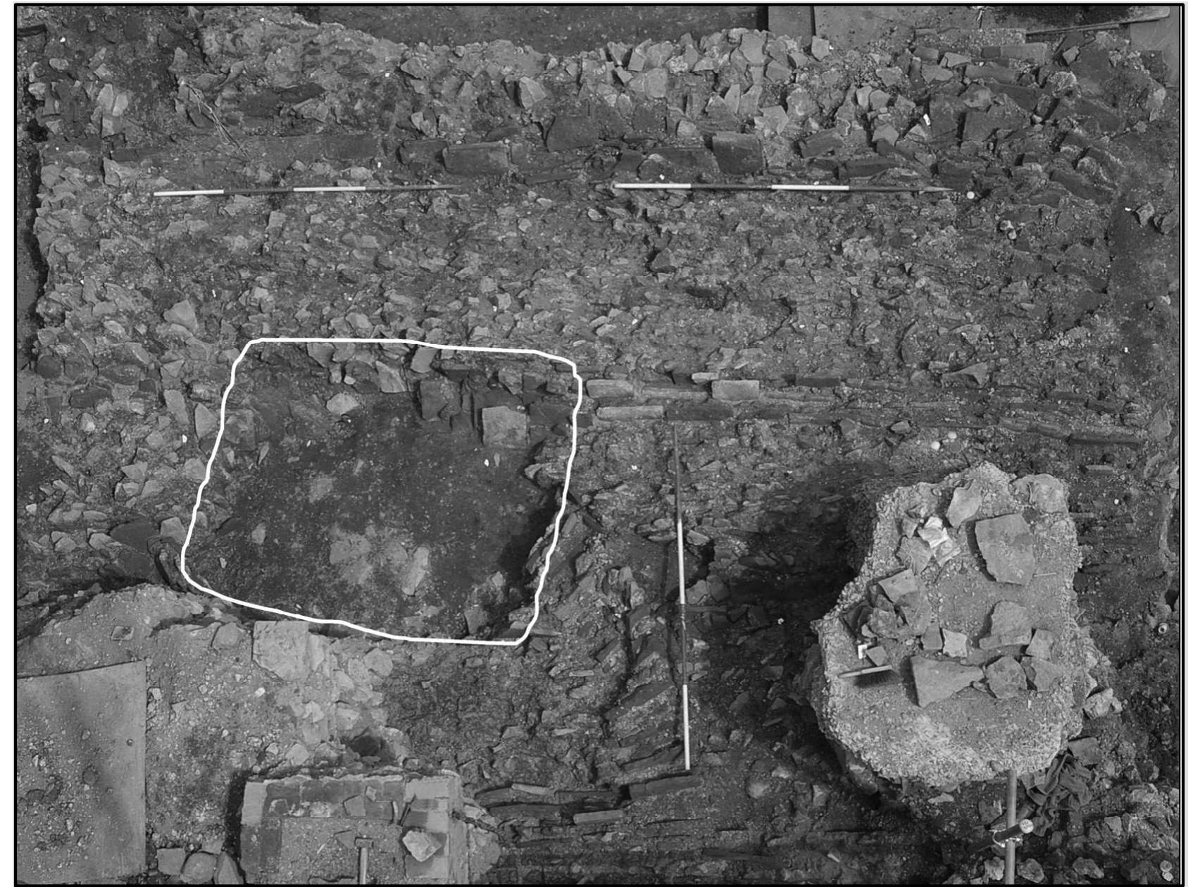 Plate 10. The Saxon sunken-featured building built over a collapsed gable-end of the Roman macellum (From Freeschool Lane, Leicester) 