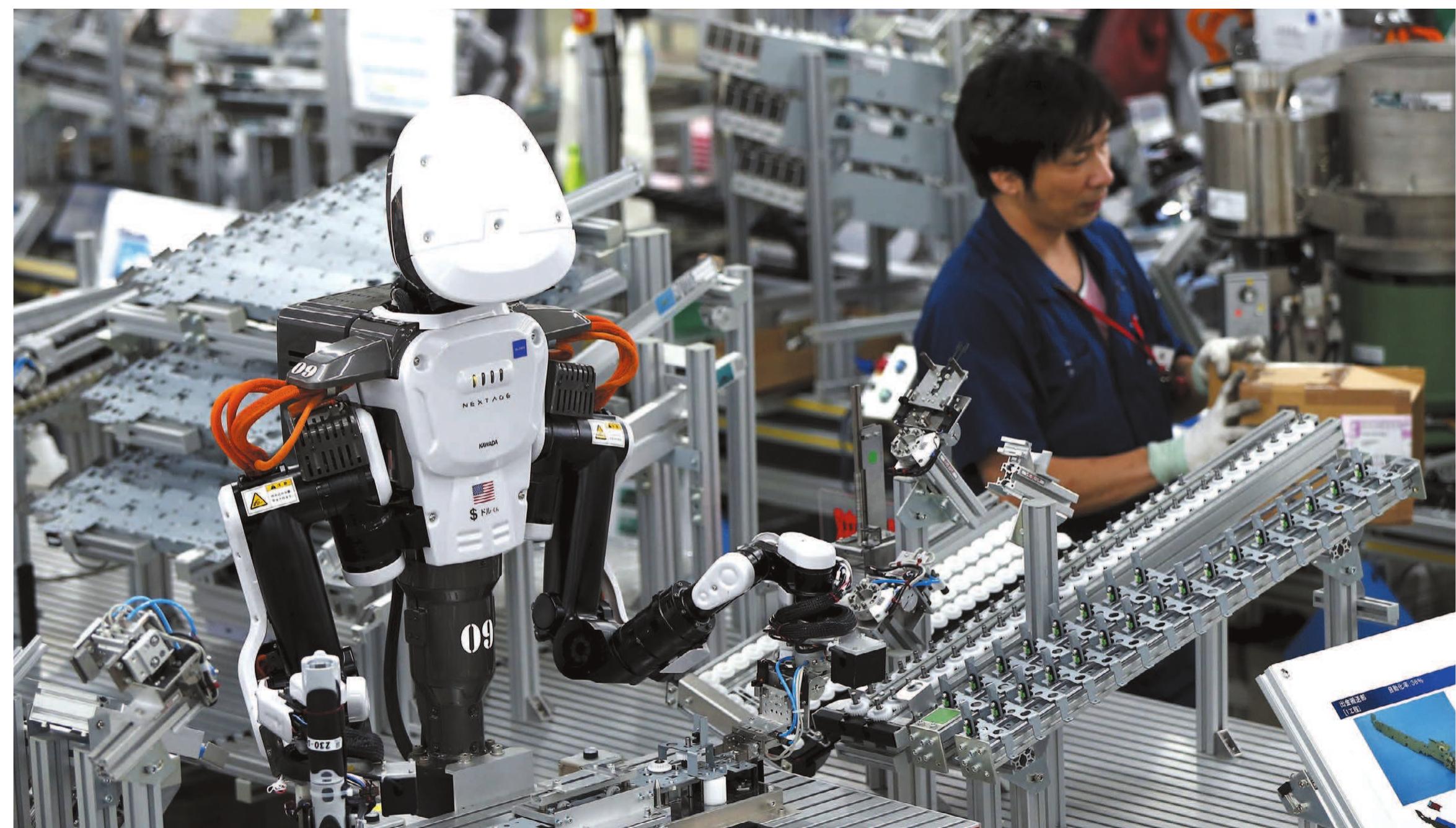 Humans and robots work alongside each other at glory in
