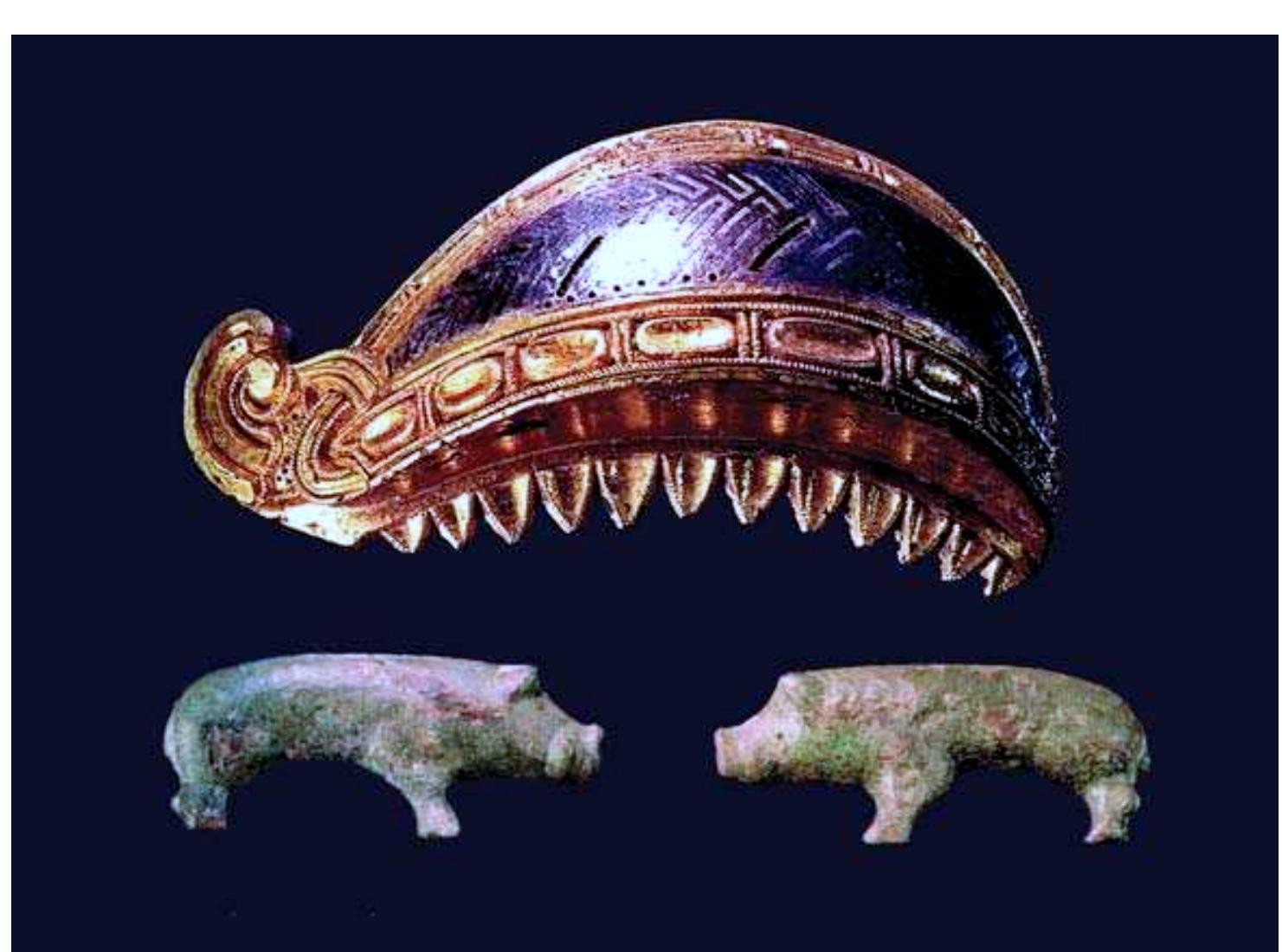 Figure 8. The eyebrow arch made of gilded bronze with silver inlay (68mm) and two mountings shaped like boars of bronze belonging to a helmet. Probably of local manufacture and dated to the Merovingian period (photograph by B. Almgren).