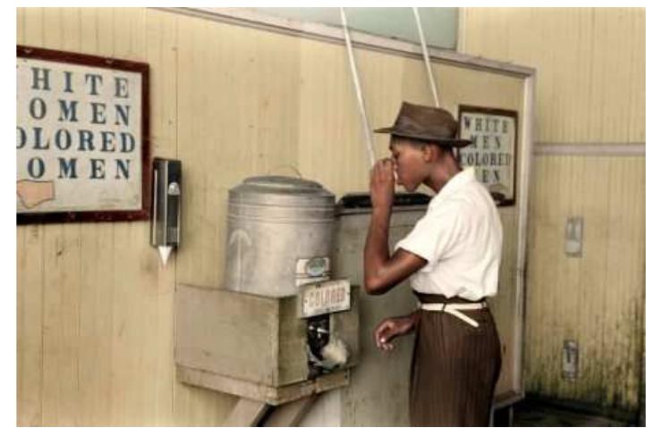 ST,  —e————————EE—— ae  This scene of silent simultaneous satiation signifies not a breakdown in the relationship between observer and observed, but rather, in a single image, the social intimacy shared by Hurston and Lewis. Toward the end of their work together, “Cudjo’s friends down the bay caught us a marvelous mess of blue crabs,” Hurston recalls. “So the next day about noon, I was sitting on his steps, between the rain- barrels eating crabs. When the crabs were gone we talked.” Here, the silence is not described but implied, suggesting that ethnographer and informant have fallen into a rhythm of quiet companionship.  — es 4 q . eo 4 4 es .—- = wae  After walking and talking, “Kossula ceased speaking and looked pointedly at his melon rind. There was still lots of good red meat and a quart or two of juice,” writes Hurston. “I looked at mine. I had more meat left than Kossula had. So we lifted the half-rinds to our knees and started all over again.” What ensues is one of the more poignant scenes of companionship in Barracoon: “Watermelon halves having ends like everything else, and a thorough watermelon eating being what it is, a long over- stuffed silence fell on us.”  ry © |... fm "9% ...¢ .*.... @:...... 2. peti s®.  . 1 tae. Ci ee ia ele CUD. a aia mC 