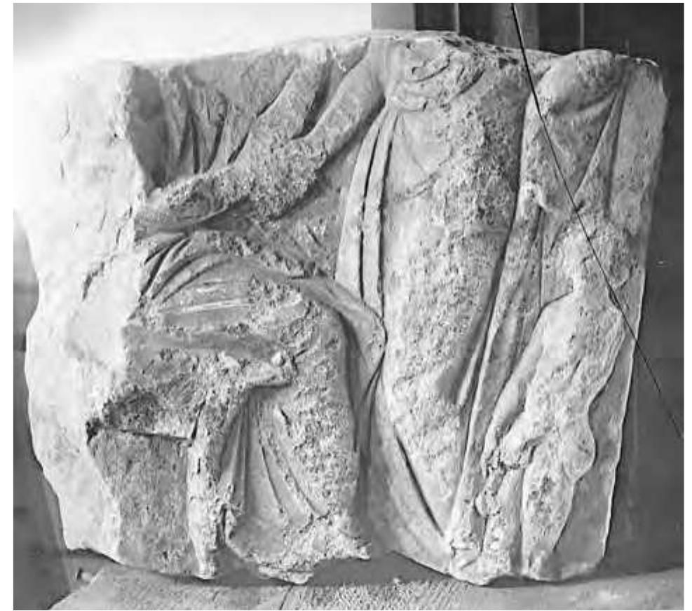 Figure 12.7 Fragment of Attic (?) grave stela, fourth century BC, probably from Naukratis. (Photo: Petrie Delta Series no. 401; © Egypt Exploration Society.) 