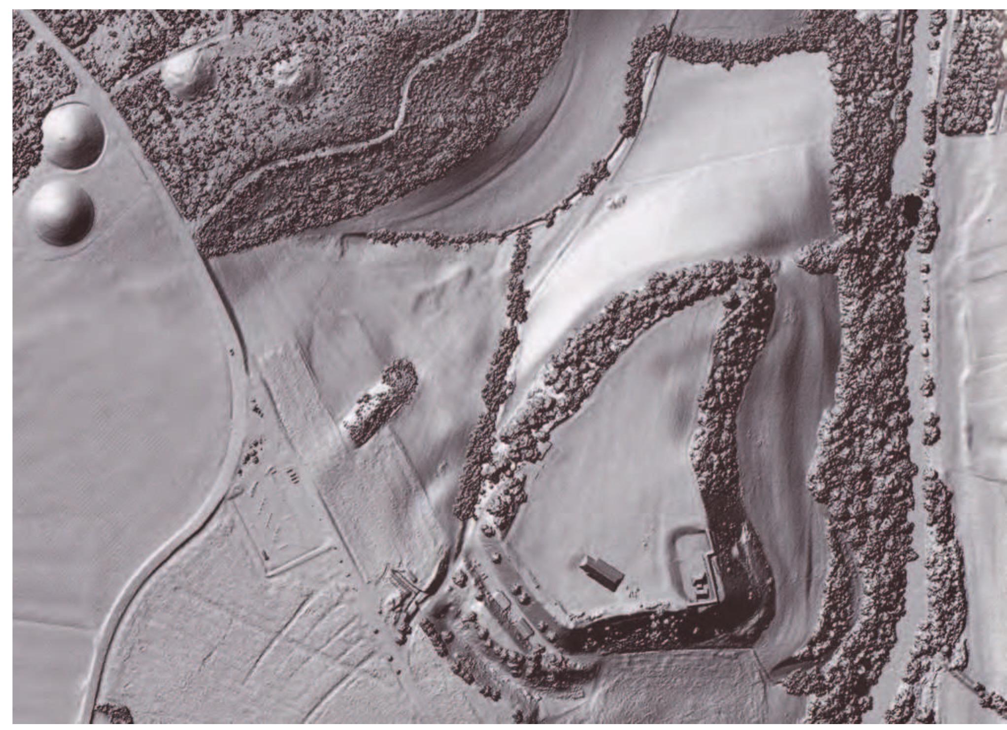 After a huge fire which destroyed the mud-brick wall and the Aufvensiedlung in period IVa/2 in the middle of the sixth century Bc — at the end of Ha D1 - the Aufsensiedlung was abandoned in Ha D2 and four large burial mounds (Giefiibel-Talhau-Nekropole) of up to 75 m in diameter (Fig. 6.8) were built in its place.  The main problem is to locate the associated cemetery. The Miinsterberg is today located on the German eastern side of the Rhine. Before flood man- agement of the Rhine, the Miinsterberg was invariably an island set within the different historical courses of the Rhine, necessitating the placement of cem- eteries outside the flood zone. Some burial grounds are known at a distance of least 6 km on both sides of the Rhine, in what is now Germany and France. Some groups of burial mounds are known at [hringen.  Figure 6.8. The Heuneburg and the rebuilt GieSiibel-Talhau-Nekropole (left side on the top) in the LiDaR scan (Landesamt fiir Denkmalpflege im RP Stuttgart/]. Bofinger, Flugzeug, Laser, Sonde, Spaten — Fernerkundung und archiologische Feldforschung am Beispiel der friihkeltischen Fiirstensitze. Esslingen: Landesamt fiir Denkmalpflege,  2007, 30). 