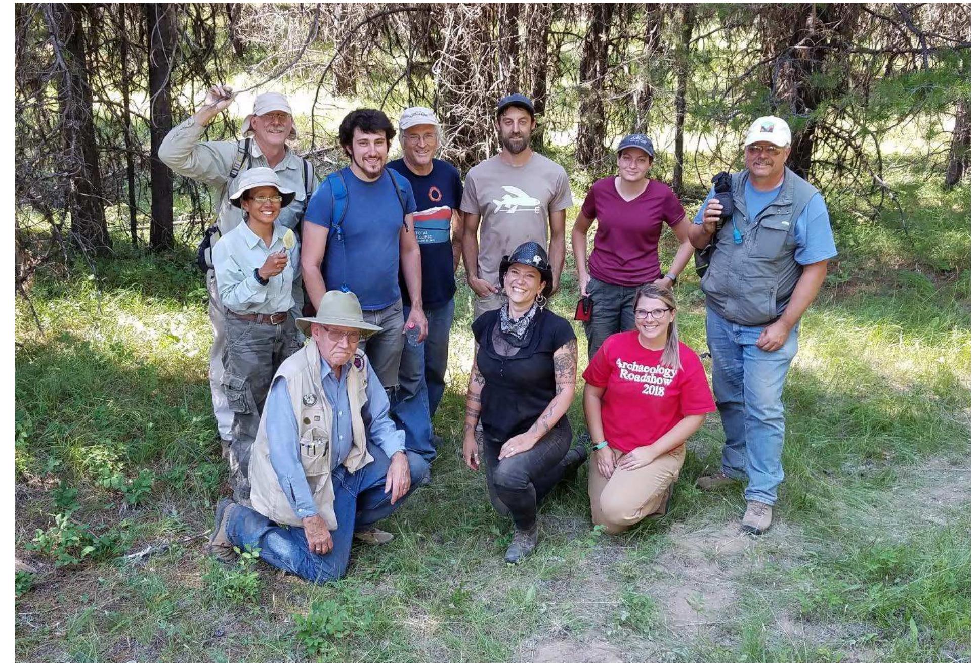 From the public land management perspective the information gathered during this project helps us better understand the nature and significance of the sites. Historic sites such as these are very vulnerable to the effects of wildfire and land management activities. This project has confirmed the presence of organic and other fire sensitive artifacts. In the current climate regime wildfires are growing in severity and scale. It is impossible to eliminate the risk of wildfire so we need to balance the risk associated with removing fuels (trees and brush) on the sites to reduce the severity of the fire with the risk of allowing wildfire to burn through the site at the current fuel load. The information our volunteers are gathering helps us to find the proper balance to preserve these sites for future generations.  Figure 20. The crew at the end of the final day of the project... looking fresher, and cleaner, than we felt 