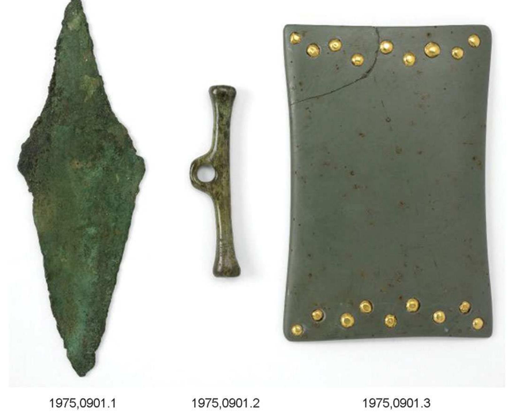 Figure 1. Stone ‘wrist-guard’ (right) and side-looped bone toggle (length 65.5mm, diameter 14mm max. at loop), Barnack (Cambridgeshire), c. 2350-2100 BC, found with a copper dagger (left) and beaker (not shown). © The Trustees of the British Museum. 
