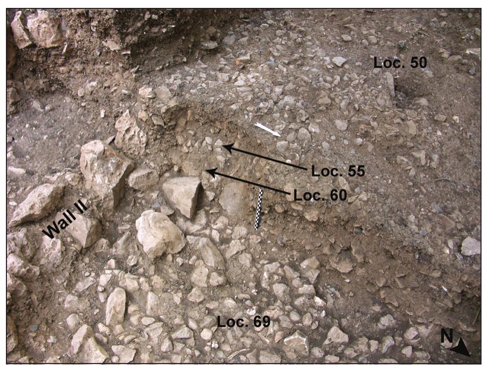 Figure 7. Oblique view on the sequence of stony floors and sandwiched fills of Structure IT. 