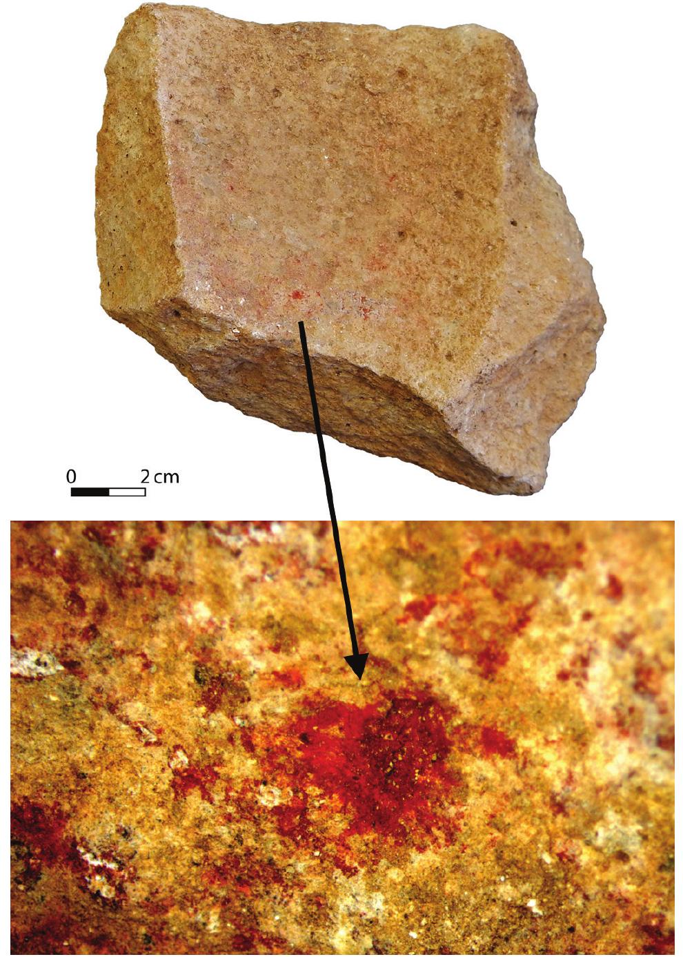 Figure 34. Mortar rim fragment with ochre residue found in unclear context at EWT.  of compact basalt and limestone. Both have a round/oval  The two upper grinding stones are broken and made yf compact basalt and limestone. Both have a round/oval 