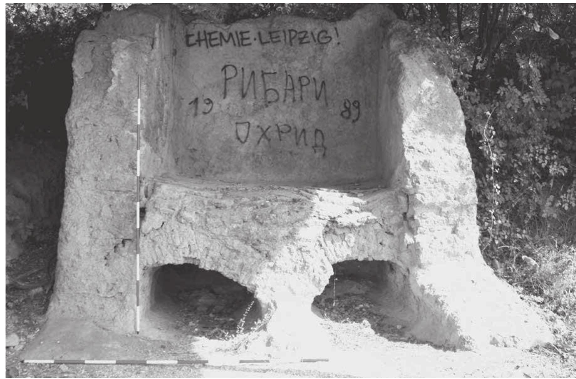 Fig. 10: LA kiln for architecture ceramics, OH_ID_2032 (photo by P. TuSlova).  OH_ID_2032 (OHRID_34_01); kiln (LA)  A large Late Antique kiln for architecture ceramics, discovered (based on the AKM) in 1969 during construction works of a road leading from Ohrid to Sv. Naum. The kiln is well preserved, located under a protective roof next to the modern road (Fig. 10). The kiln has a rectangular plan of side ca.3 mand features two chambers. The preserved height is also about 3 m. Based on parallels from Bulgaria and Romania, it might be with a high probability dated to the 6c. AD and classed to the group of kilns producing bricks and roof tiles (Yorov - HARIZANOV 2017). 