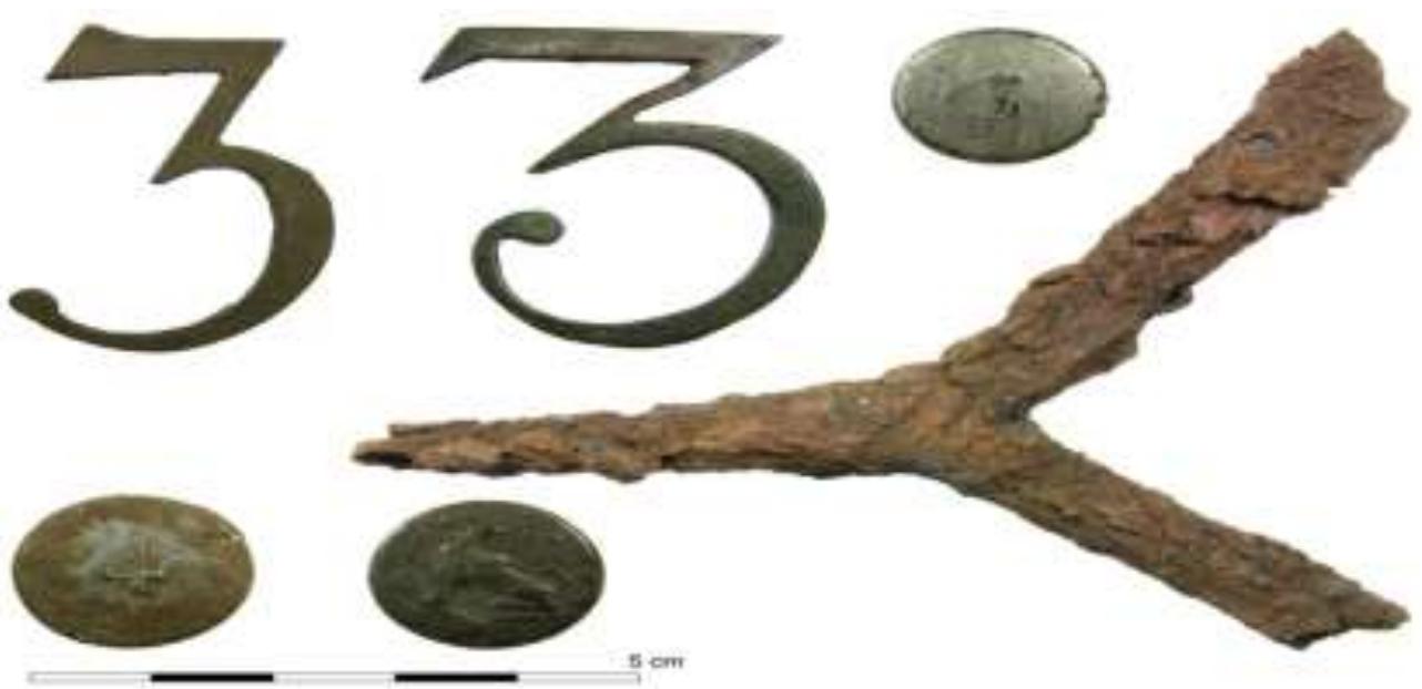 Figure 5: A selection of the finds from the camp at Bussum. Musket maintenance tool, two shako cap badges and a uniform button likely of the Dutch 3rd Regiment Jagers, a button of the Dutch 4th Regiment and a Dutch general service button (1806-1810 pattern). Source: PAN. 