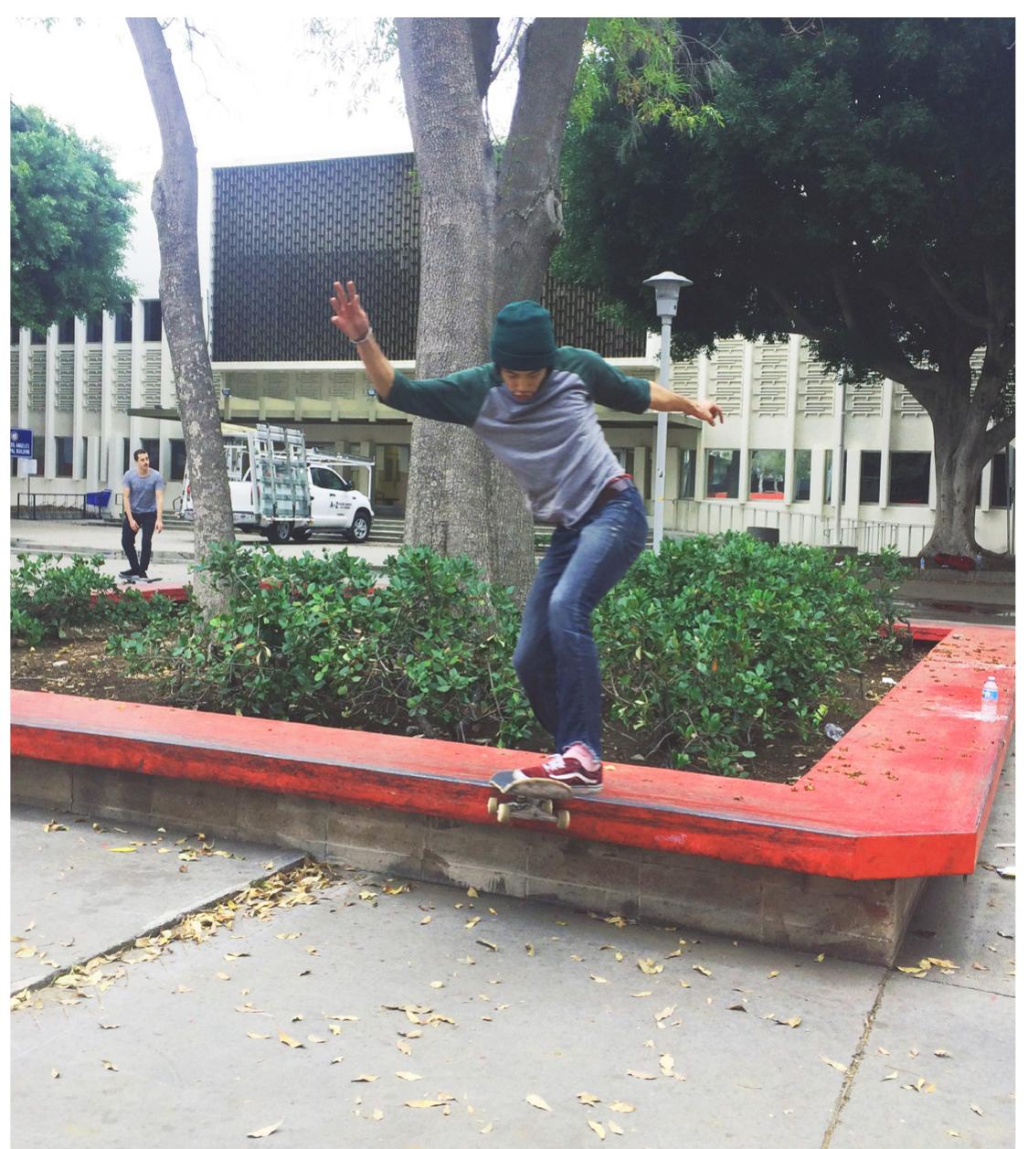 Skater tailslides on ledges within West LA Courthouse court- yard. Photo by Chris Giamarino. 
