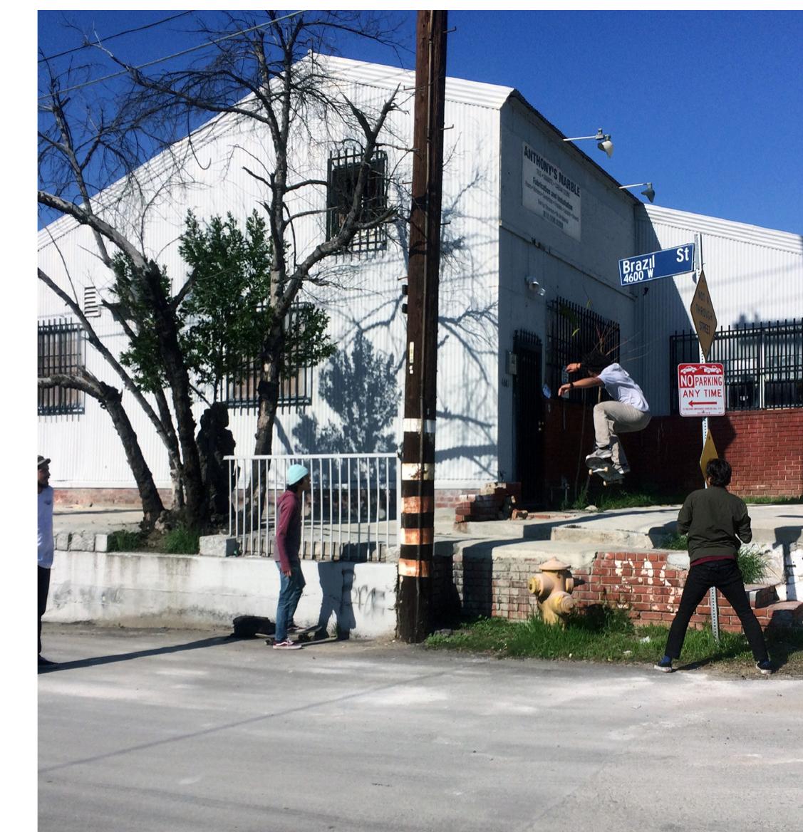 Hydrant ollie as others watch. Photo by Chris Giamarino. 