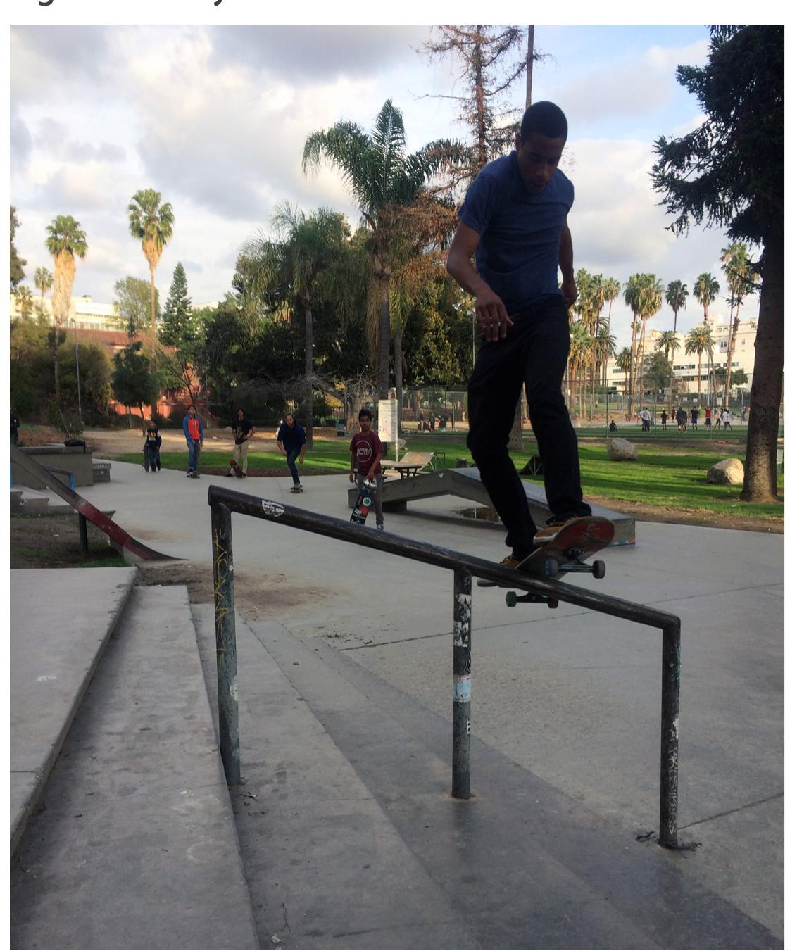 Skater boardslides down handrail. Photo by Chris Giamarino.  skateboarders present. The two most popular days 