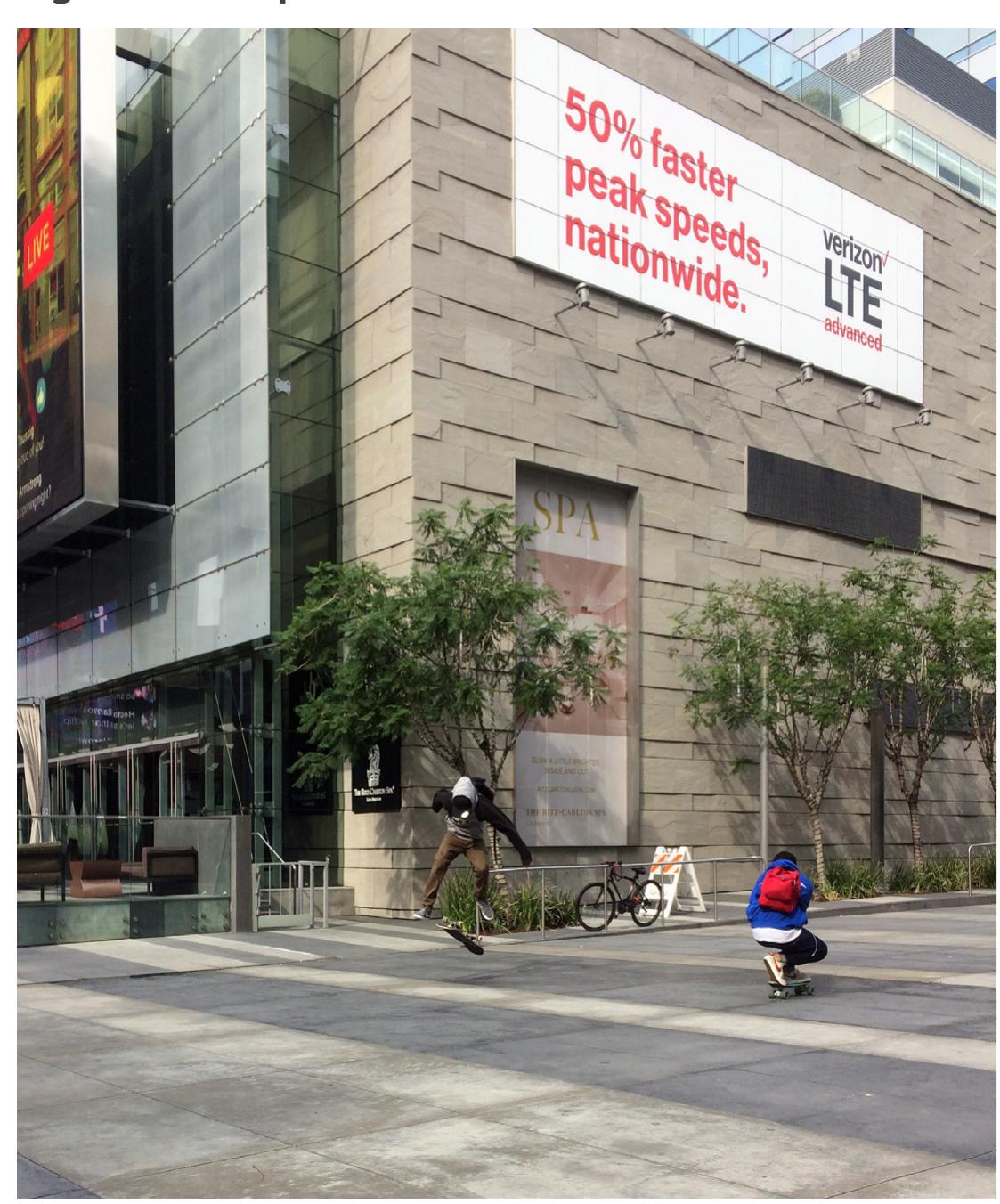 Skater 360 flips while friend films in front of Ritz Carlton Hotel. Photo by Chris Giamarino. 