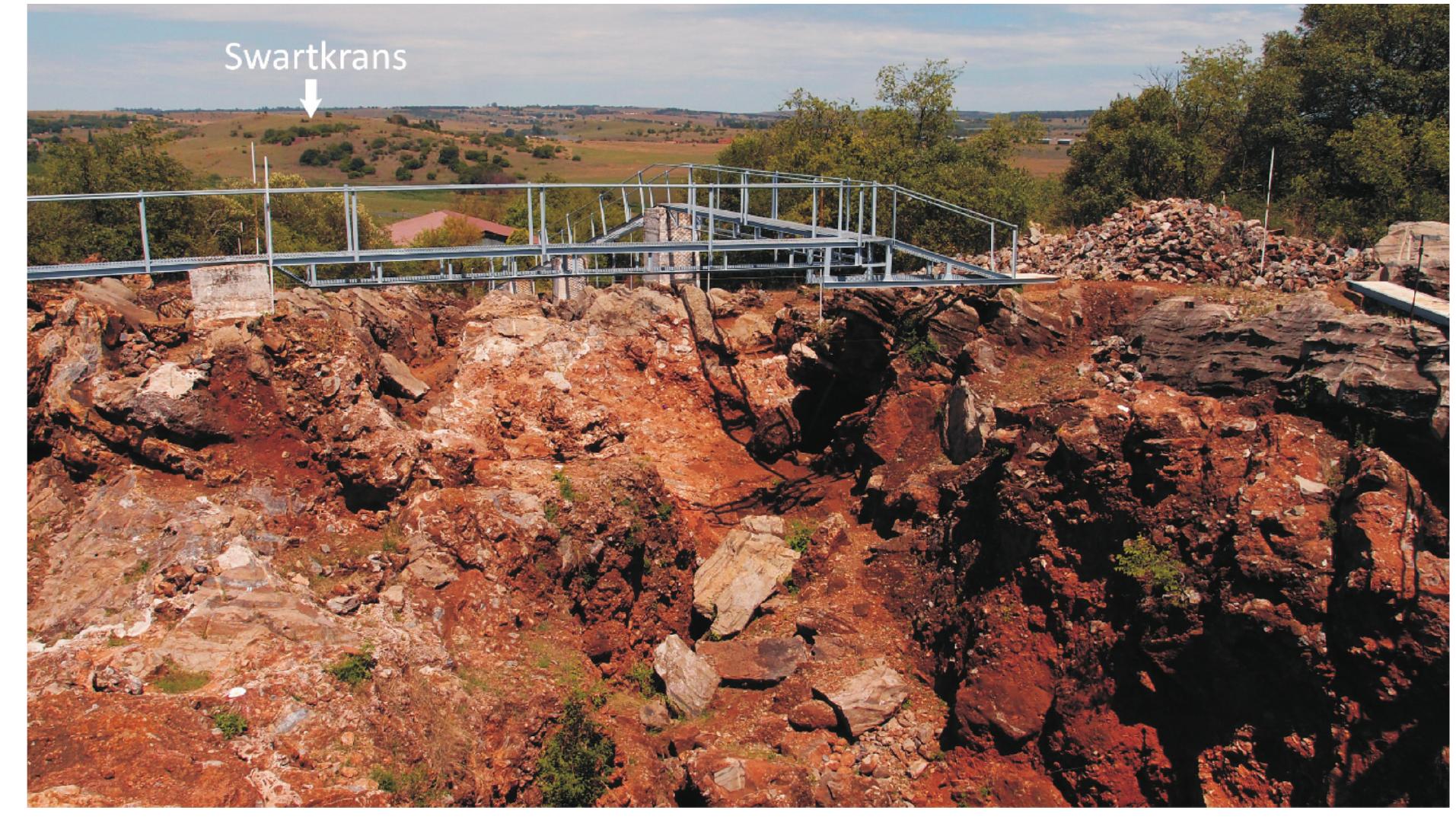 FIG. 2. A view of Sterkfontein Members 4 and 5, with Swartkans Hill in the background. 