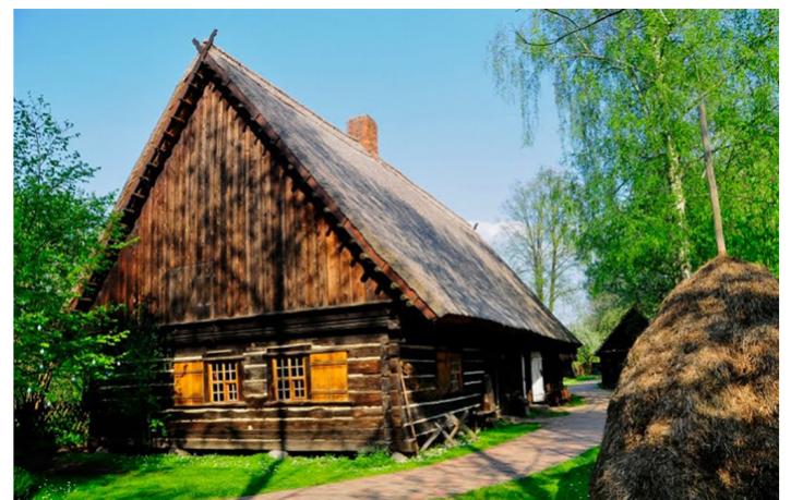 After the adoption of the Geneva Declaration by the International Coun- cil of Museums (ICOM) in 1956, the European Open Air Museum Associa- ion (AEOM) was established in 1972 to determine international criteria for open air museums. AEOM suggested the protection and restoration of rural buildings in their original environment as far as possible in order to raise the scientific quality of the open air mu- seum approach (Eres, 2016: 162). The notion of preserving cultural assets in their authentic environment began to be accepted with the introduction of modern conservation principles in 1960s. The International Council on Monuments and Sites (ICOMOS) sug- gested encouraging the open air muse- ums to protect rural buildings in-situ as well in the International Colloqium on Folk Architecture held in 1971. Al- though the educational roles of open air museums like introducing visi- tors to the past rural life are acknowl- edged, it is thought that the approach of bringing different buildings together in a new environment by dismantling them from different contexts is in con- tradiction with contemporary con- servation principles. So it can be said that such museumification approaches cannot be considered as a desirable or sustainable option for the conservation of rural settlements anymore.   Figure 5: A view from in-situ conserved museum village: Lehde Village in Spreewald Region, Germany. 