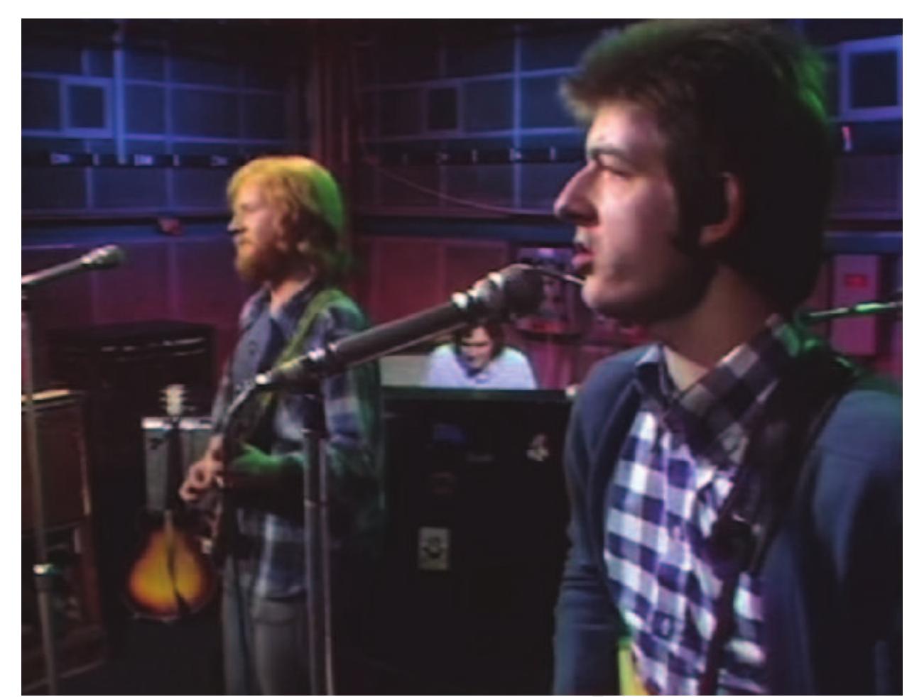 Figure 19: Nick Lowe, bassist with Brinsley Schwarz, wearing a check gingham button-down shirt on The Old Grey Whistle Test, BBC Television 1973. 