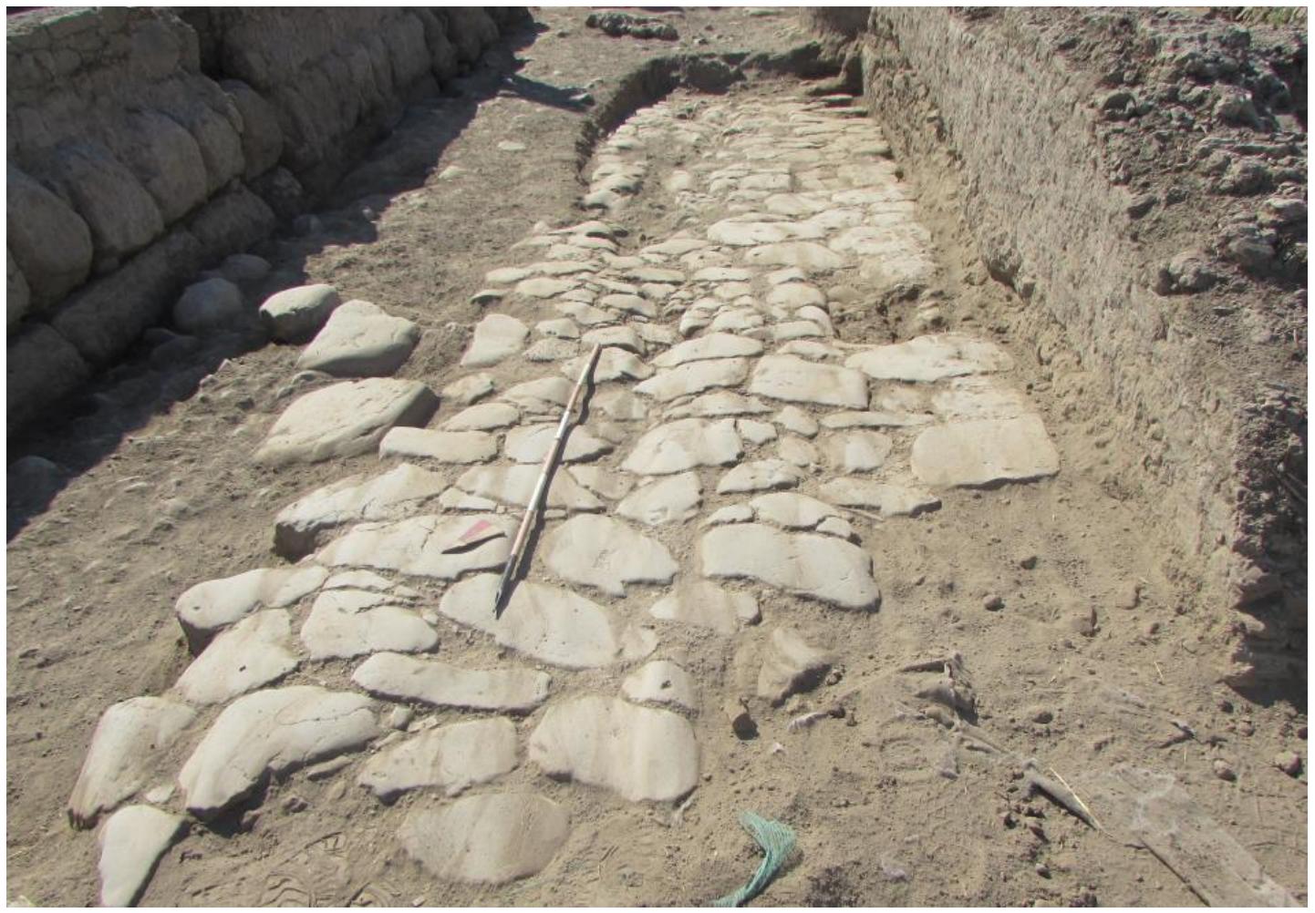 LSOPOCUUVUEL VVWILET UI Tilaill LGEUTTIN FOUaU,. Subsequently, the roadbed was fi  led by yet another major layer of glareate, raising the level of the road-  way some 0.21 m (323; Road 33); ceramic evidence would date this phase to the later 34 or early 2 century  BCE (cf. Table 6, PI. Ill nn. 16-19), con  emporary with the second glareate phase of Road 1 (Road 13). To the  S, as it descended toward the intersection with the main thoroughfare, the roadway was instead paved in worked basalt slabs (6039; fig.16), laid on top of the earlier glareate surface (6040) and joining the earliest bas-  alt pavement of the Via Gabina, of mid-  Republican date. Although its full extent has not been preserved due to  post-abandonment activities, it seems likely that, as with the limit of the basalt-paved stretch of ROAD 1 at the edge of the property of the mid-Republican domus, this pavement of Road 33 too would have terminated abr- 