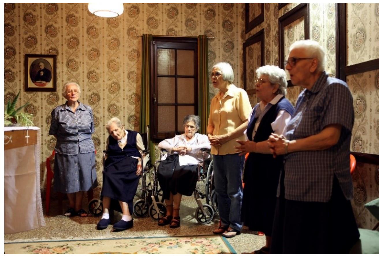 JWit taAliti,  Following this work, I created Les Filles de la Croix, a multidisciplinary urtwork that proposed to unveil the hidden and profound lives of a lisappearing order of nuns. One might assume a diametrically opposed world o that of the striptease dancers, however, whether it is by choice or ‘ircumstance, in both instances these communities of women live their lives on the margins of society. The extended communities the nuns serve are the oof, the vulnerable, the sick, and the destitute, thereby both their life and  VOL.  k is with the other. By observing their ways of being over a ten-year  veriod, what resonated most deeply was a quality of slowness and presence  1oli  ke anything I had experienced. I wanted my artwork to directly respond  ot  his by evoking an atmosphere where stillness and temporality became  angible; a meditation on the texture of slowness, the nature of listening, and he relationship between attention and time.  I collaborated with Les Filles de la Croix in the creation of this project in Canada, Brazil, Argentina, and France where I painted portraits of the nuns, conducted one on one interviews, and photographed and videotaped the physical spaces in which they have spent most of their lives. My ongoing artistic concerns were further developed by allowing me to create stages for female subjects that counter those that gender, race, and class stereotypes have relegated them to, specifically as foot soldiers of a patriarchal religion.  