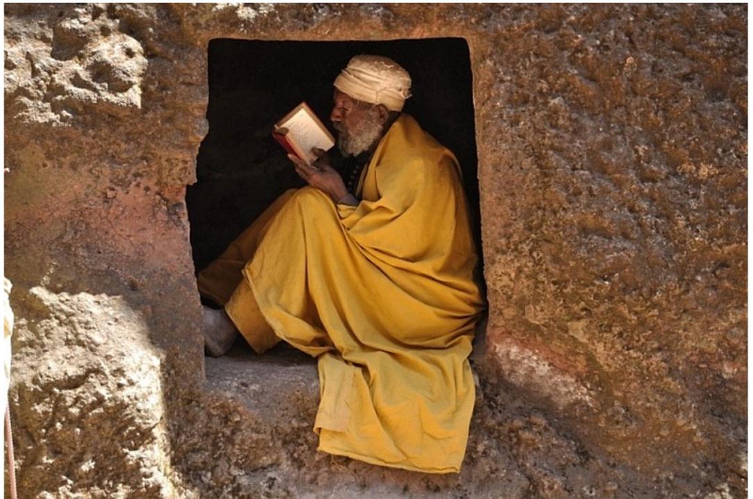 1 Bahitawi monk, Lalibela, Ethiopia (photograph provided by www.travel-tour-guide.com/)
 [5] The case of India may help us to get a more vivid idea of how emotionally charged
the visual experience of the hermits’ sanctified bodies could be. In Jain digambara
tradition the holy men’s alterity is manifested by their being naked (digambara means
"covered with air"). Pilgrims pay homage to their bodies, whose nudity works as a
visual hint at the naked appearance of the most important Jain tirthankaras, the wise
men who attained illumination and therefore established a fordable passage across
the sea of continuous births and deaths, the samsara.’° Similarly, the look adopted by
those Hindu sadhus who devote themselves to the perpetual worship of Shiva is
deliberately meant to reproduce that displayed in the God’s standard images: they
wear matted hair, sit on the ground in the lotus position, cover their body with white
powder, and hold the trident, Shiva’s most distinctive iconographic attribute.*’
