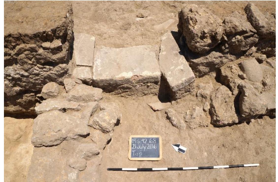 Fig. 22. Brick threshold between Walls QQ and QQ1, looking east.  R. Souza — A. Walthall — J. Benton — E. Wueste — A. Tharler — B. Crowther — C. Schirmer @ Preliminary Report on the 2016 Field Season of the Americ Excavations at Morgantina: Contrada Agnese Project (CAP) 