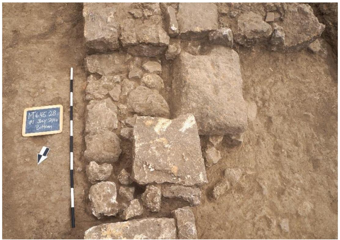 Fig. 34. Possible door in Wall GG2 (Trench 45), looking south.  Fig. 33. A selection of objects recovered from the cluster of finds in Trench 43 (Room 11a) 