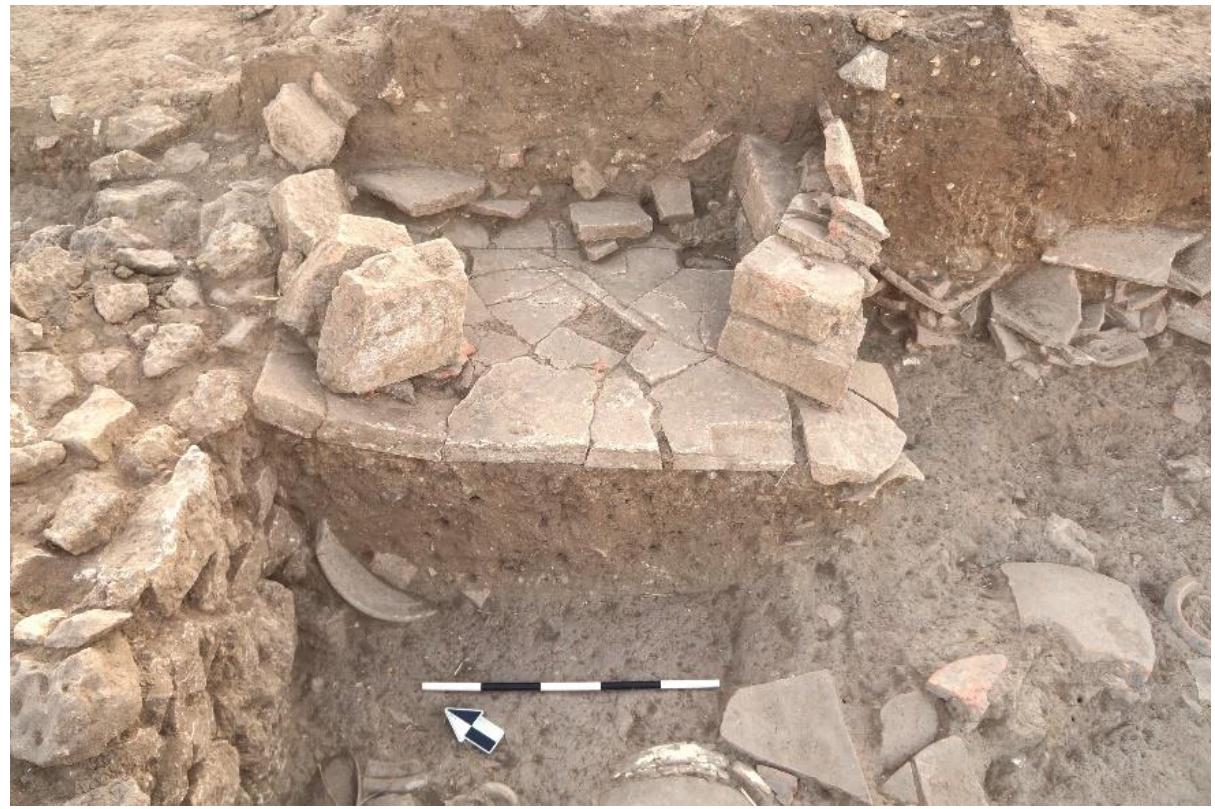 Fig. 40. Oven built over clean fill in Room 11a, looking east.  R. Souza — A. Walthall — J. Benton — E. Wueste — A. Tharler — B. Crowther — C. Schirmer @ Preliminary Report on the 2016 Field Season of the Americ Excavations at Morgantina: Contrada Agnese Project (CAP) 