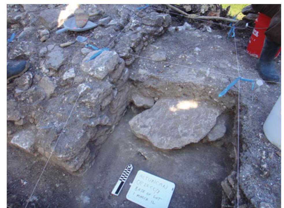 Figure 4. A large vault stone buried in a door of Structure 19a’s superstructure. (Photograph: Thomas R. Jamison.) 