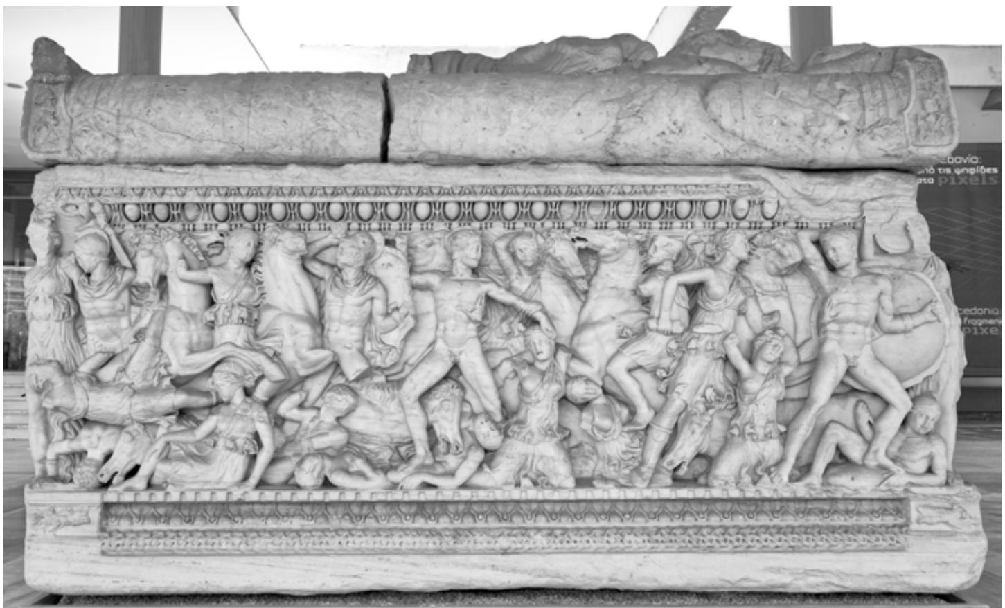 Fig. 10: Thessaloniki, Archaeological Museum Inv. 283 (Kintrup 1999, no. 214). Attic sarcophagus with amazonomachy and reclining couple on the lid. The centre of the frieze is accentuated by a group of victorious Greek and Amazon. The back and small sides continue the theme of the front side. 2nd quarter 3rd cent. AD. The monumental sarcophagus ranks among the largest Attic exam- ples (Photo: author).  group of victorious Greek and Amazon. The back and small sides continue the theme of the front 